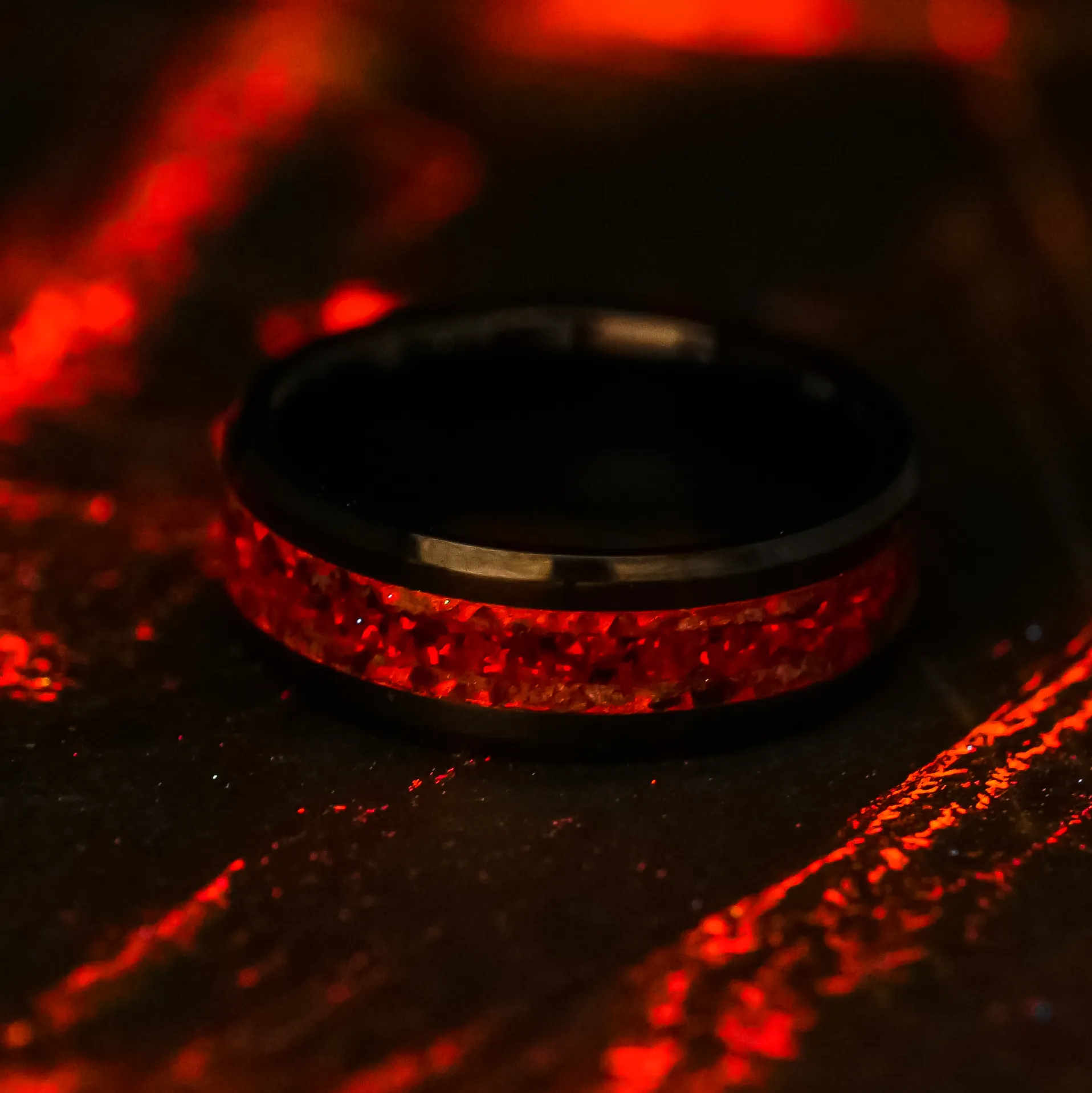 Garnet Lava Pit Glowstone Ring on Black Ceramic